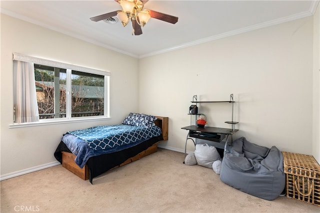 bedroom with ceiling fan, light carpet, and ornamental molding