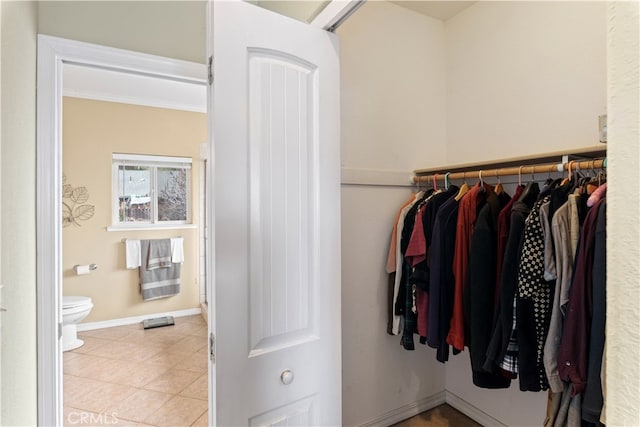 spacious closet featuring light tile patterned floors