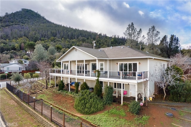 back of house featuring a mountain view