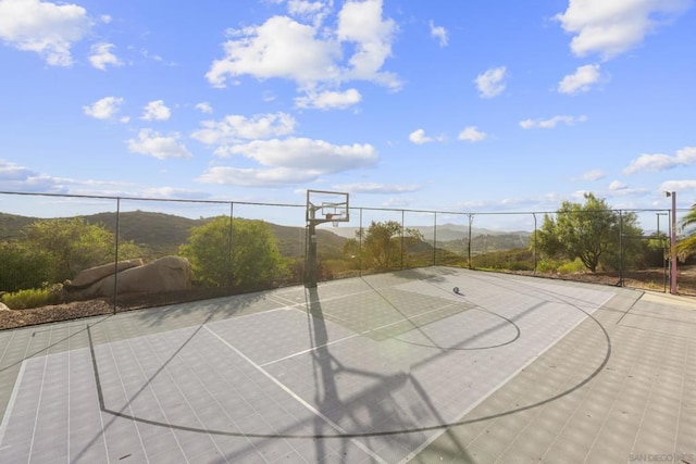 view of sport court with a mountain view