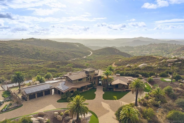 birds eye view of property with a mountain view