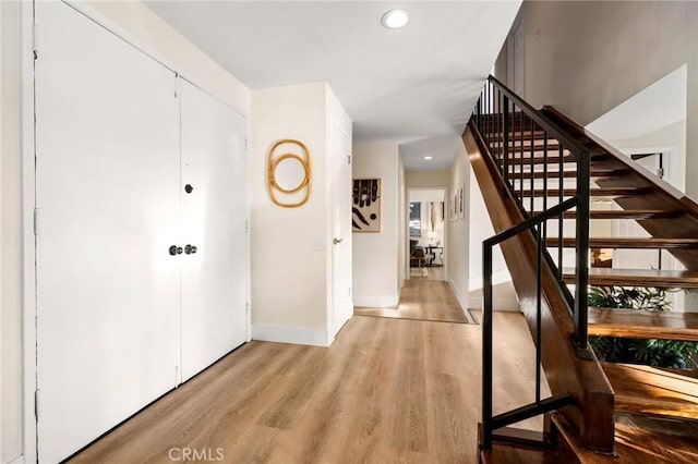 7385 Darnoch Way, West Hills, CA 91307 - entryway with stairs, light wood-style floors, and recessed lighting