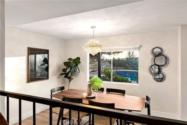 7385 Darnoch Way, West Hills, CA 91307 - dining area with a chandelier and wood finished floors