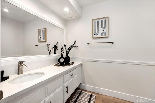 bathroom featuring vanity and wood-type flooring