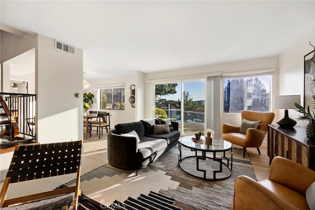 7385 Darnoch Way, West Hills, CA 91307 - living room featuring wood finished floors and stairway