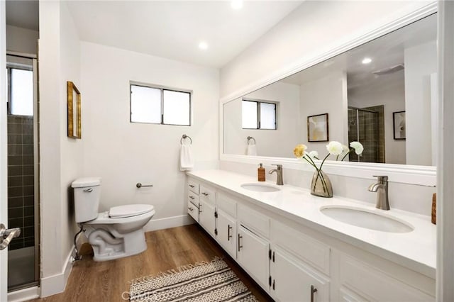 7385 Darnoch Way, West Hills, CA 91307 - bathroom with a stall shower, double vanity, wood finished floors, and recessed lighting