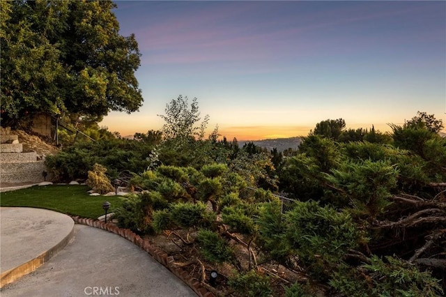 7385 Darnoch Way, West Hills, CA 91307 - yard at dusk with a lawn