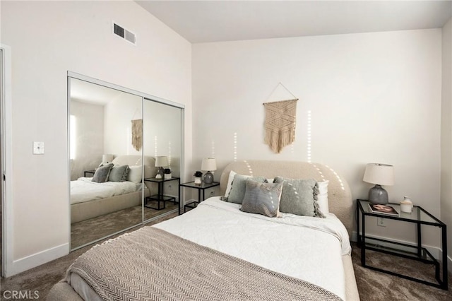 carpeted bedroom featuring vaulted ceiling and a closet