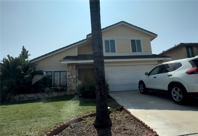 view of front facade with a garage and a front lawn