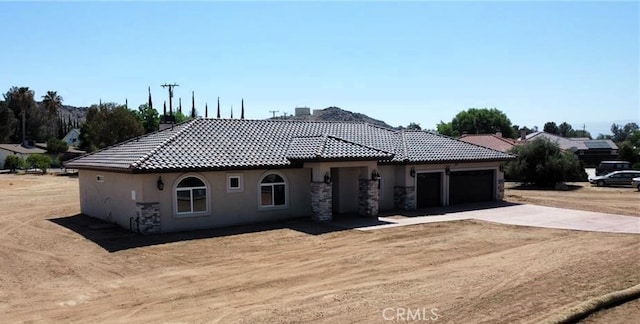 view of front of property with a garage