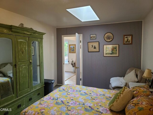 bedroom featuring a skylight