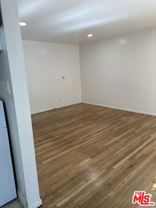 spare room featuring dark hardwood / wood-style floors