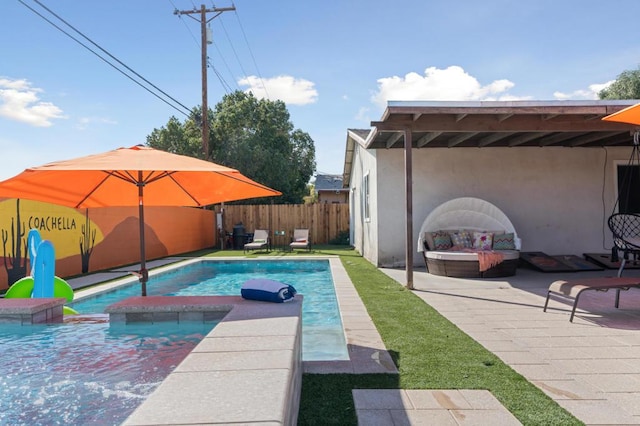 view of pool featuring an in ground hot tub and a patio