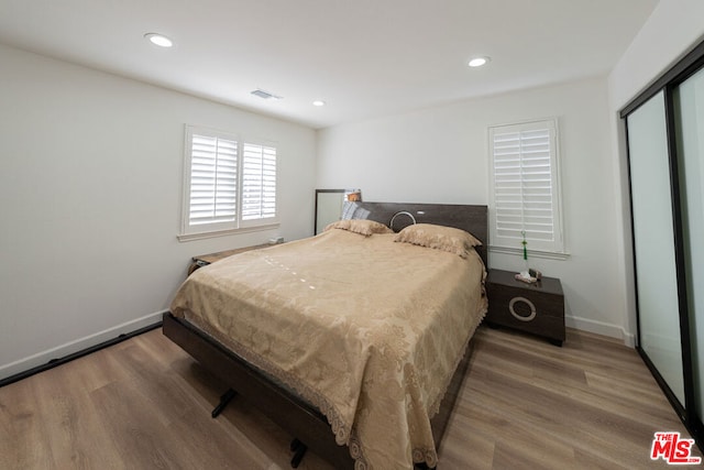 bedroom featuring hardwood / wood-style flooring