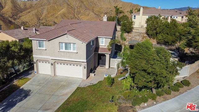 view of front of house featuring a mountain view and a garage