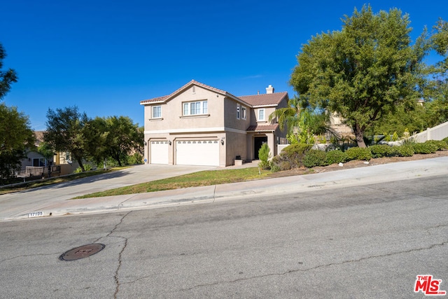 view of front of property with a garage