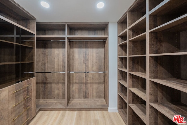 spacious closet featuring light wood-type flooring