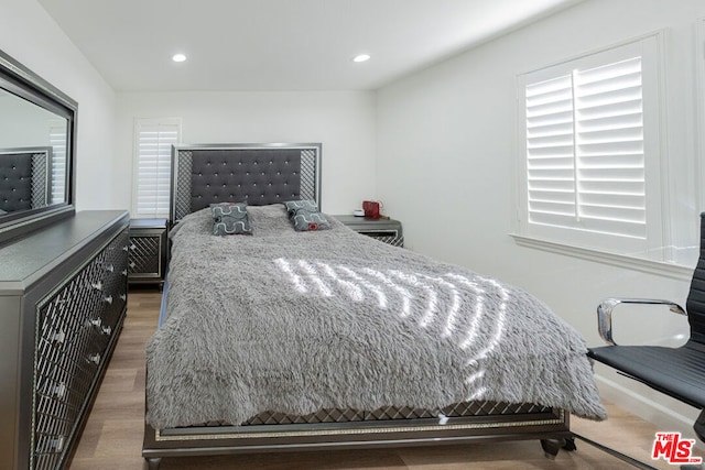 bedroom featuring dark hardwood / wood-style flooring