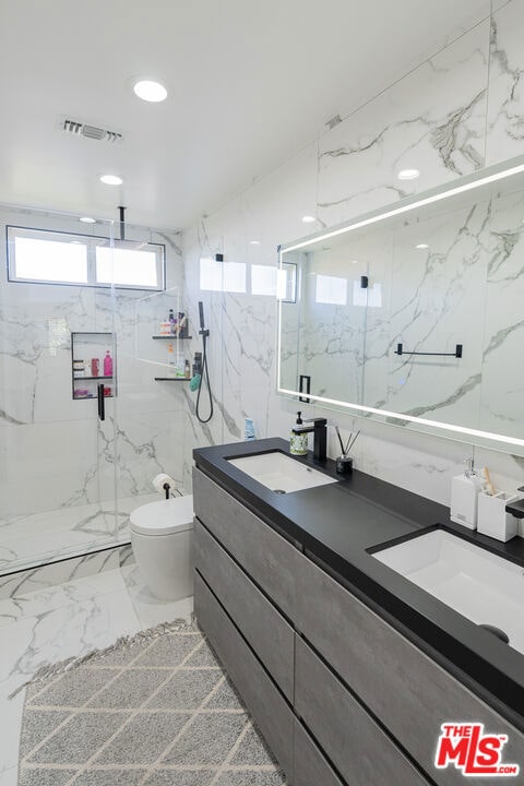 bathroom featuring walk in shower, vanity, and toilet