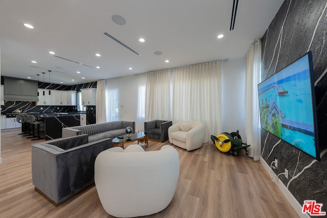 living room with light hardwood / wood-style flooring