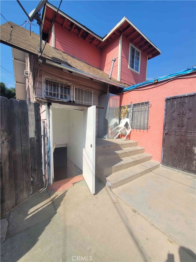 view of exterior entry featuring a patio