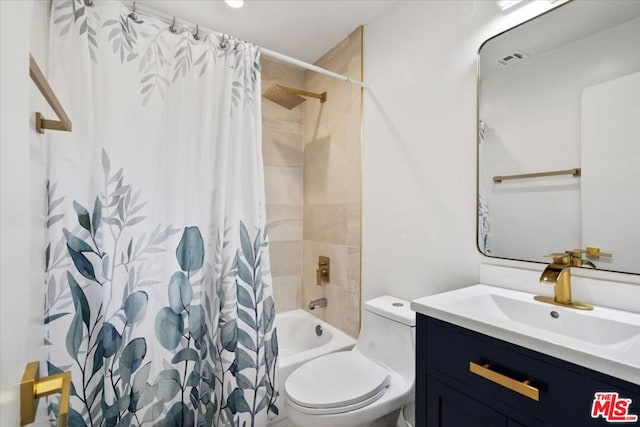 full bathroom with vanity, toilet, and shower / tub combo