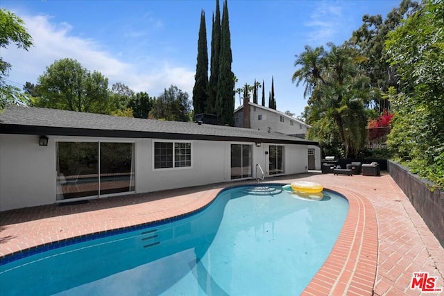 view of pool with a patio