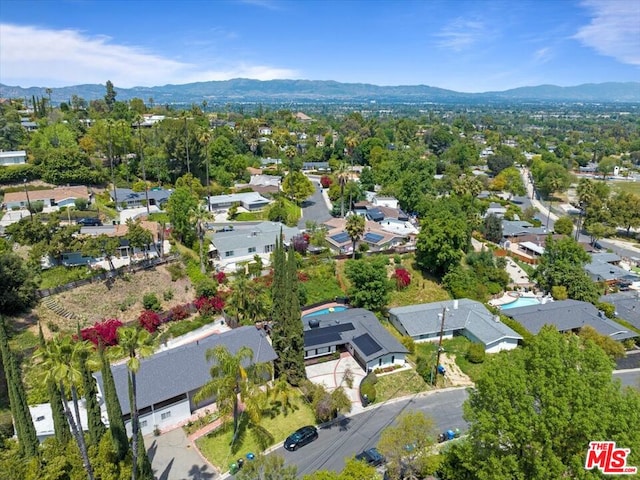 birds eye view of property featuring a mountain view