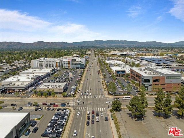 birds eye view of property featuring a mountain view