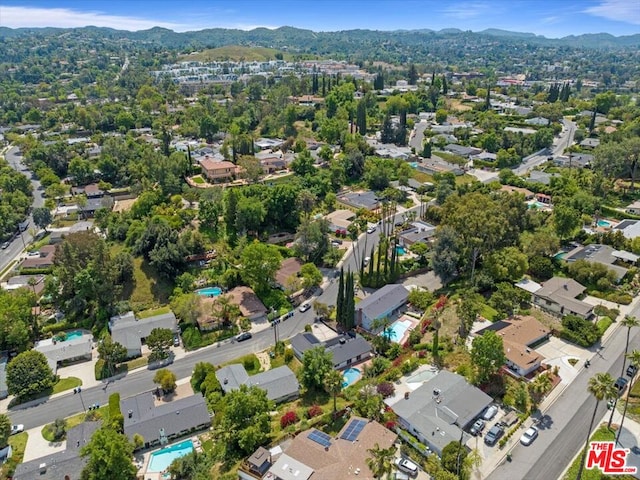 birds eye view of property featuring a mountain view