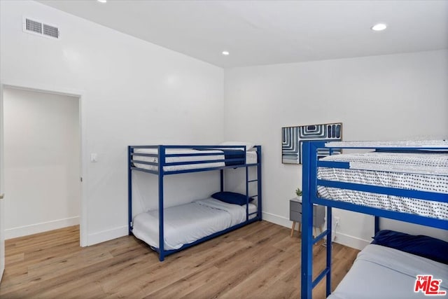 bedroom featuring wood-type flooring