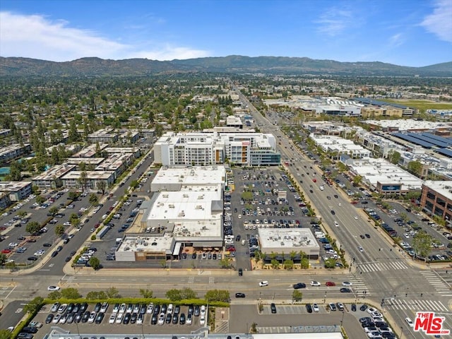 birds eye view of property with a mountain view