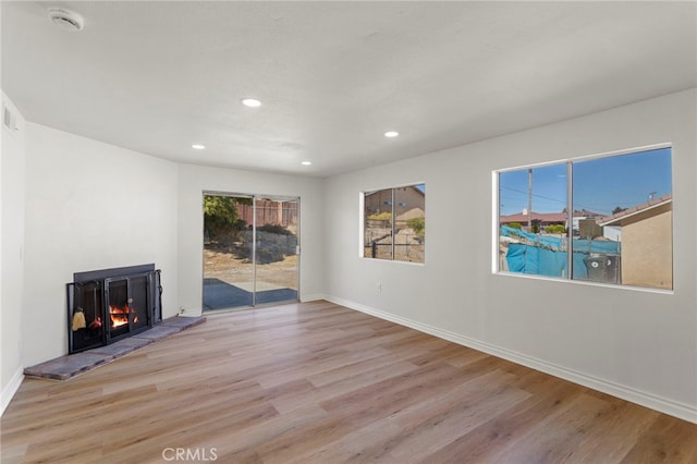 unfurnished living room featuring light hardwood / wood-style floors