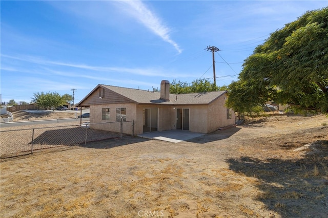 rear view of property with a patio area