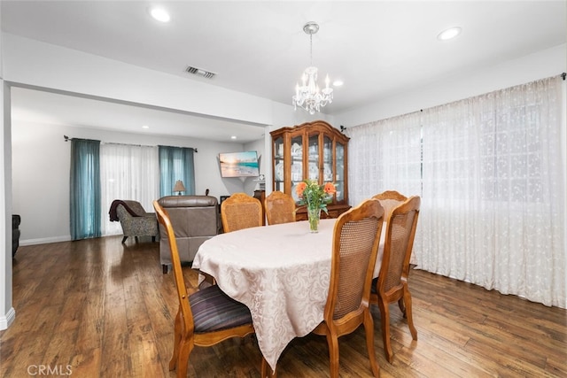 16132 Landmark Dr, Whittier, CA 90604 - dining space featuring dark hardwood / wood-style floors and a notable chandelier