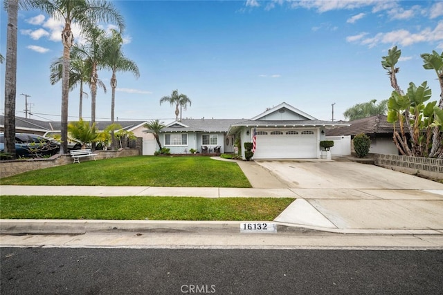 16132 Landmark Dr, Whittier, CA 90604 - view of front of home with a front yard and a garage