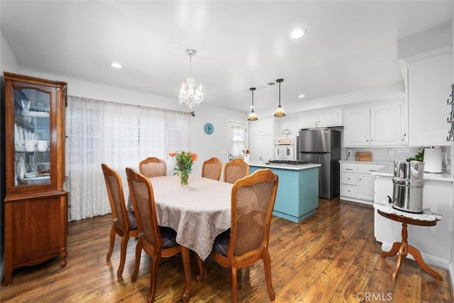 16132 Landmark Dr, Whittier, CA 90604 - dining room with dark hardwood / wood-style flooring and a chandelier