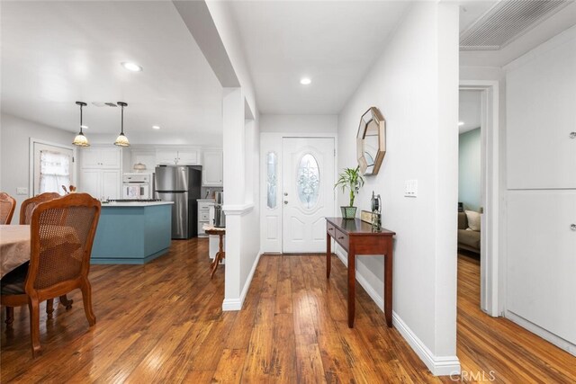 16132 Landmark Dr, Whittier, CA 90604 - entrance foyer featuring plenty of natural light and dark hardwood / wood-style floors