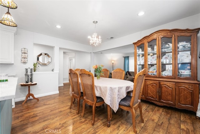 16132 Landmark Dr, Whittier, CA 90604 - dining area with an inviting chandelier and dark wood-type flooring