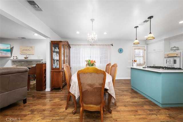 16132 Landmark Dr, Whittier, CA 90604 - dining area with dark wood-type flooring and a chandelier