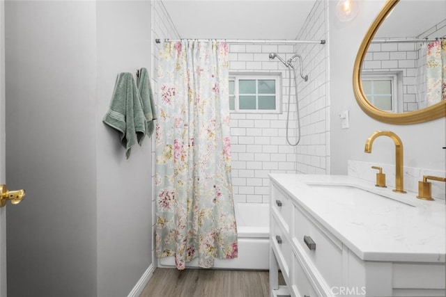 16132 Landmark Dr, Whittier, CA 90604 - bathroom featuring hardwood / wood-style floors, vanity, and shower / bath combo