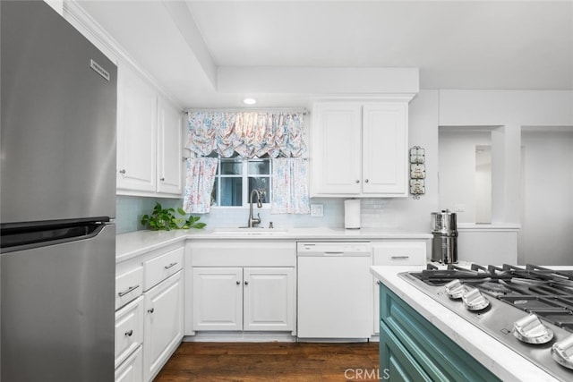 16132 Landmark Dr, Whittier, CA 90604 - kitchen with white cabinets, stainless steel appliances, dark wood-type flooring, and sink