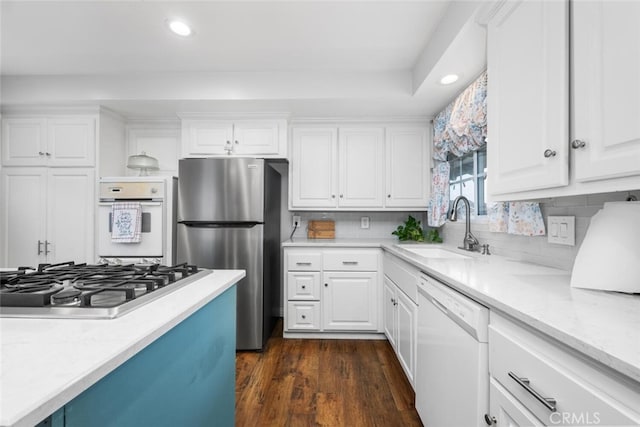 16132 Landmark Dr, Whittier, CA 90604 - kitchen featuring sink, white cabinets, stainless steel appliances, and dark hardwood / wood-style floors