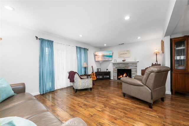 16132 Landmark Dr, Whittier, CA 90604 - living room with hardwood / wood-style flooring and a stone fireplace