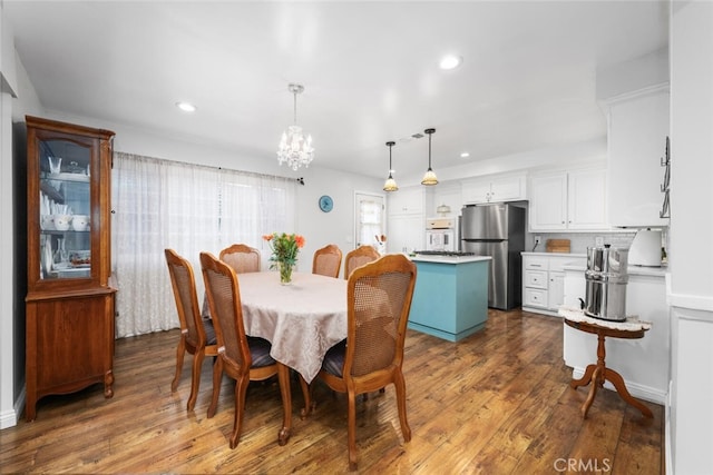 16132 Landmark Dr, Whittier, CA 90604 - dining area with a chandelier and dark wood-type flooring