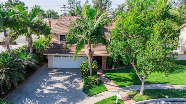 view of front of home featuring a garage and a front lawn