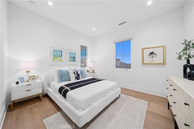 bedroom with light hardwood / wood-style floors