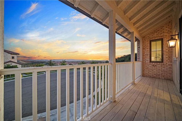 view of balcony at dusk