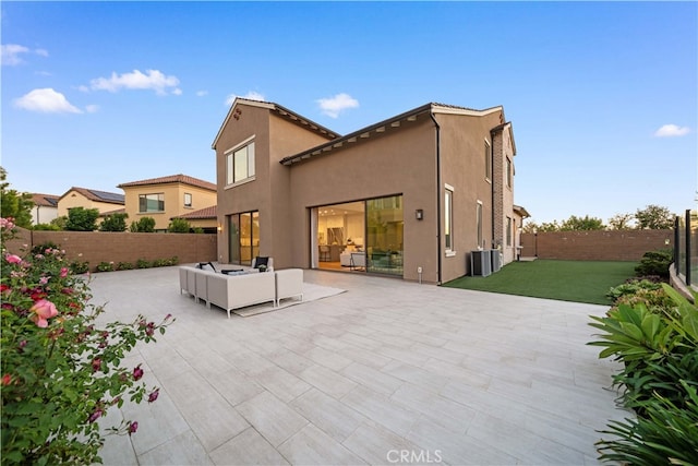 back of property with a patio and central air condition unit