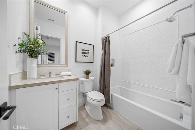 full bathroom featuring tile patterned flooring, vanity, shower / bath combo, and toilet